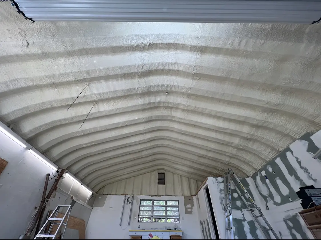 Spray polyurethane foam applied to the underside of a metal roof deck in Johnson City